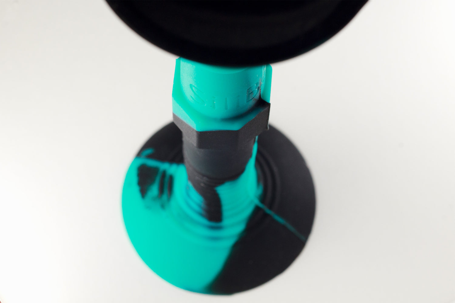 Close-up of SiliBatons Teal and Black Baton Grip Detail for Precision Throwing